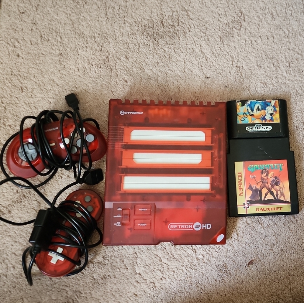 Red Nintendo 3DS XL Console with Game Cartridges
